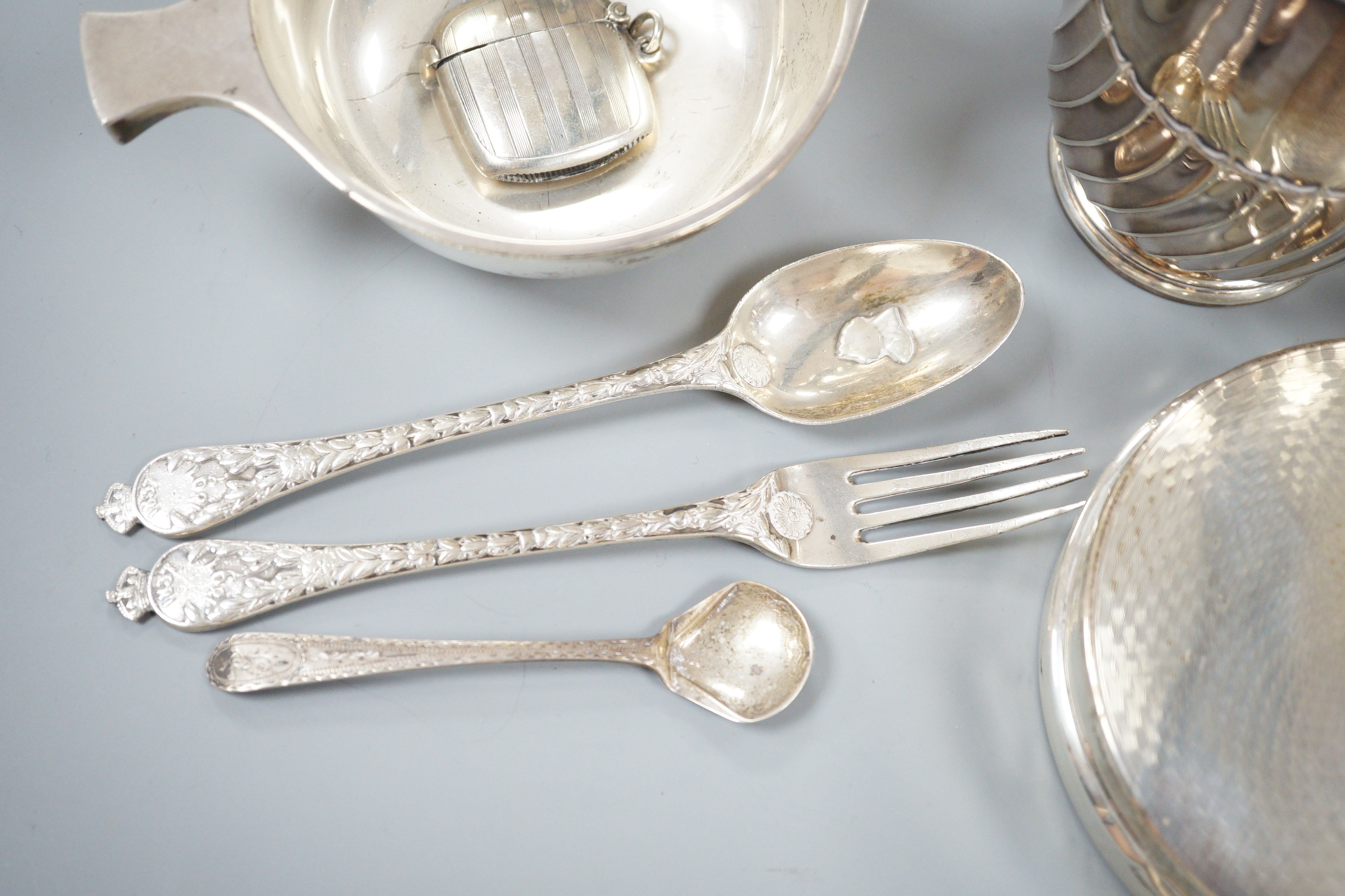 Small silver including a George V quaich, Edinburgh, 1928, a pair of condiments, circular box and cover, mug, toilet jar and three items of cutlery.